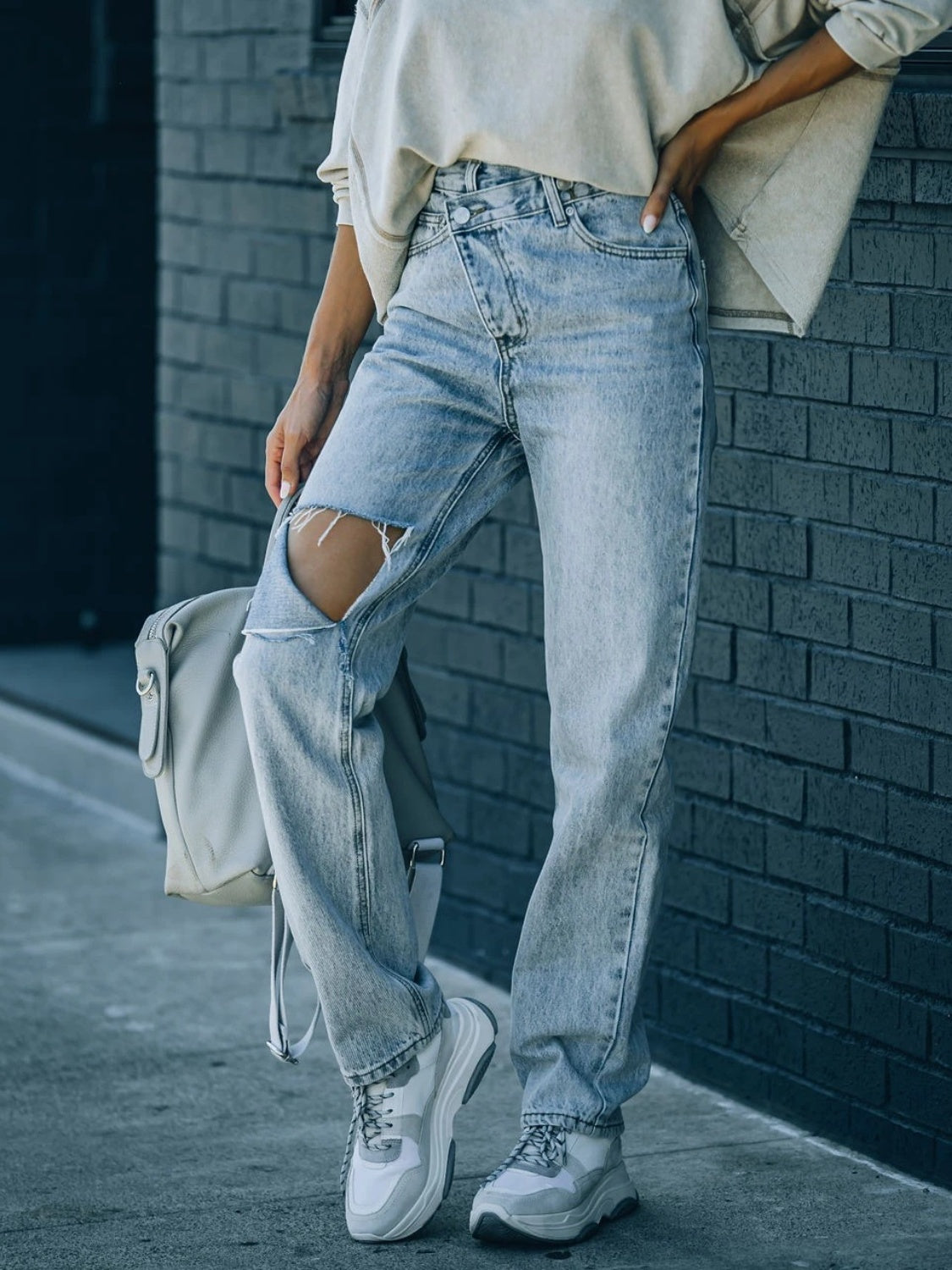 Distressed Asymmetric Waist Jeans